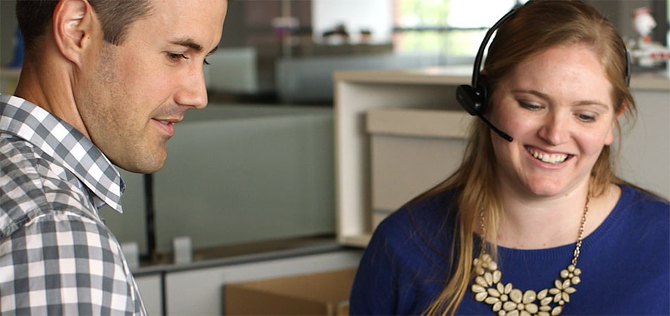 man and woman working in office